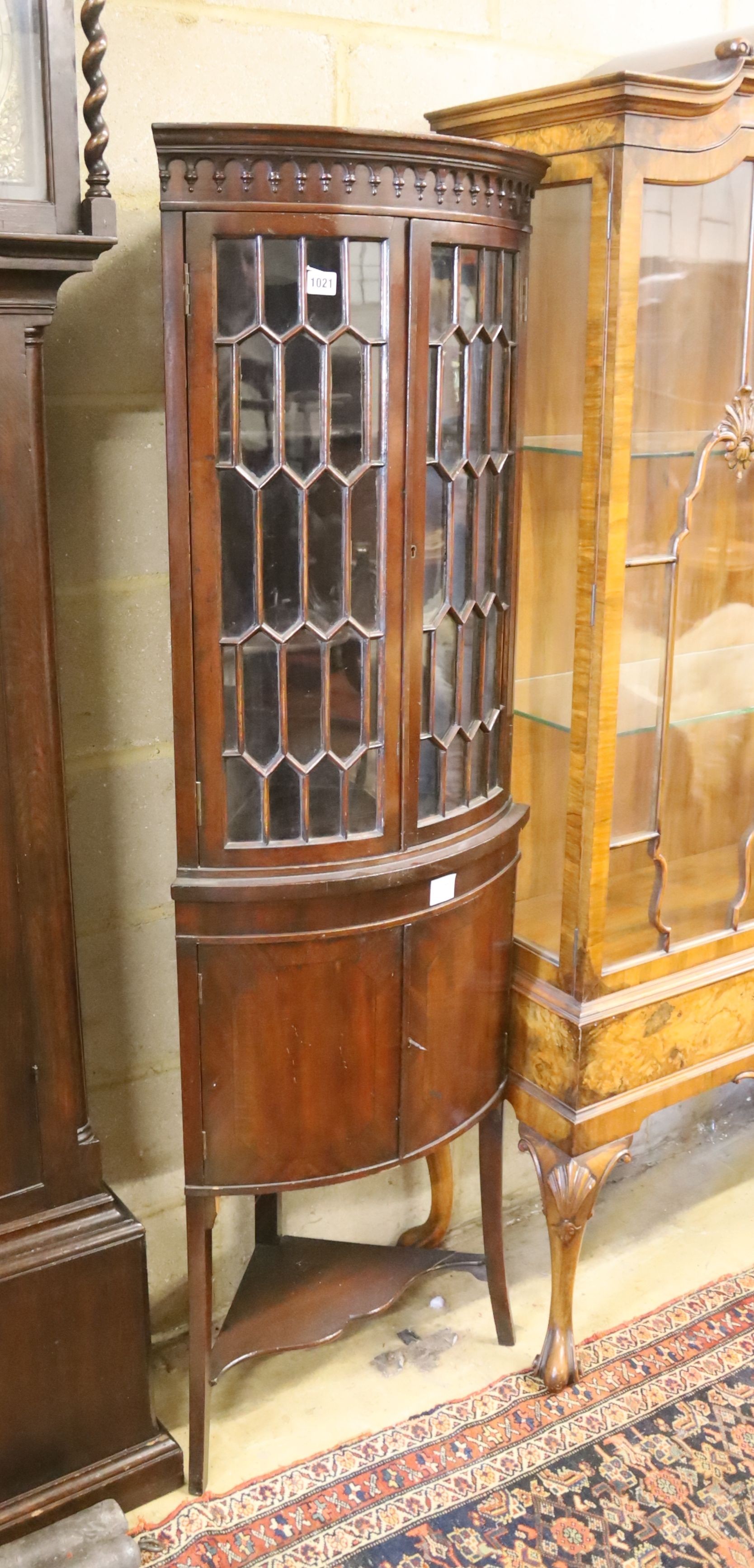 An Edwardian banded mahogany bow fronted standing corner cabinet, width 52cm, depth 38cm, height 165cm